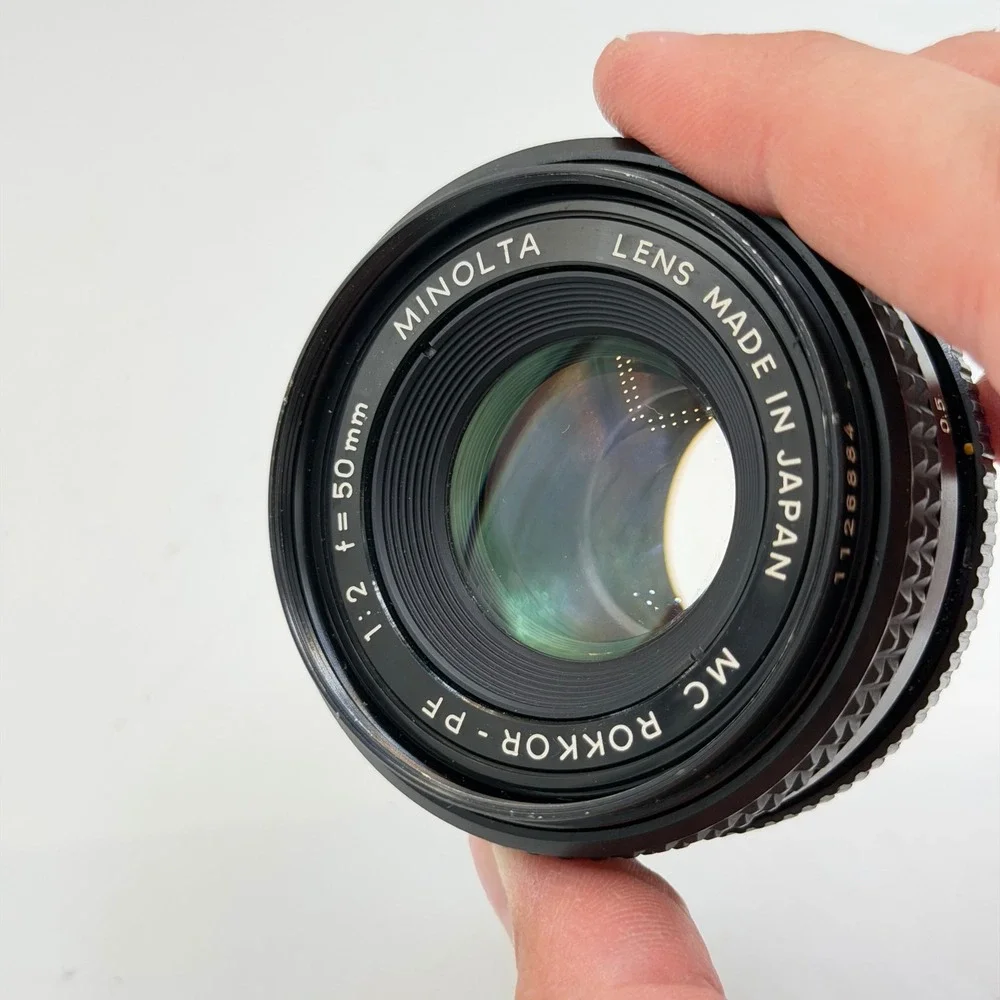Minolta MC Rokkor-PF 50mm f/2 Lens with 55mm Skylight 1A Hood SR Mount 1126884
